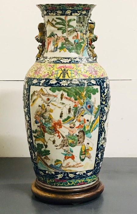 A large vase of slightly ribbed baluster form and folded rim with 'Famille verte' enamelled