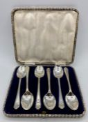 A Boxed set of six golf themed teaspoons by Walker & Hall, dated Sheffield 1933.