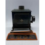A Magic Lantern and assorted slides.