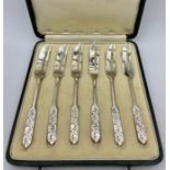 A Boxed set of silver cake forks for Liberty, London. Hallmarked Birmingham 1937.