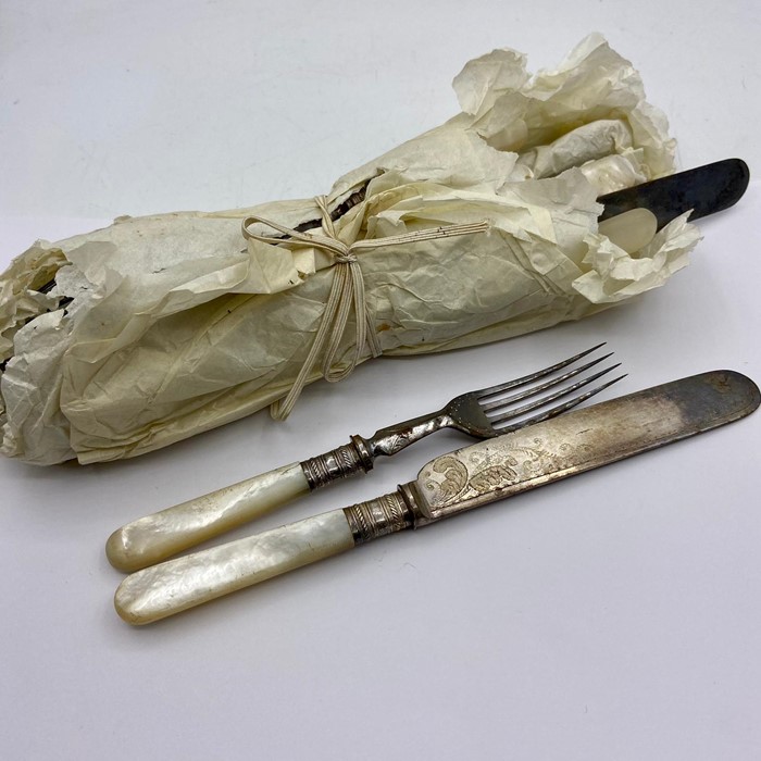 A set of vintage pear handle cutlery