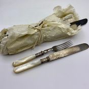 A set of vintage pear handle cutlery