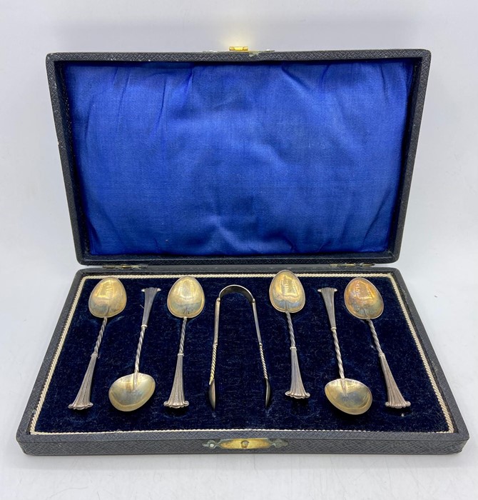 A Boxed set of silver teaspoons with sugar nips, makers mark William Devenport, dated Birmingham