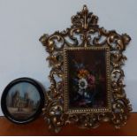 A pair of miniatures, "Canterbury cathedral" and 'Vase with flowers', signed, one in a florentine