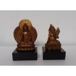 A pair of little metal gilded figures, (7x15 cm largest). Provenance: From the Sidhu Family