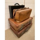 A Selection of three brown leather Vintage suitcases and a black briefcase.