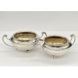 An Art Deco silver sugar bowl and milk jug, hallmarked for Birmingham 1915