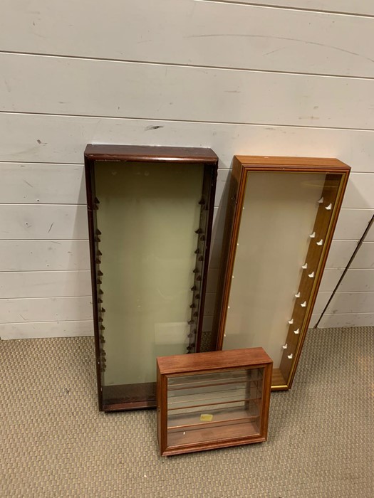 Two large display cabinets and one small display cabinet