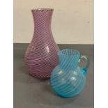 Two pieces of striped glass, one vase and one jug