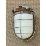 An Opaline Industrial lamp, with cage.