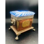 A Copper and Glass Lidded caddy on ball and claw feet with lion loop handles.