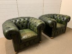 A Pair of Green leather button back, Chesterfield style club chairs.