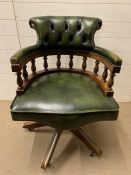 A Green leather Captains chair.