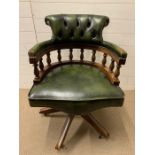 A Green leather Captains chair.