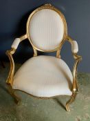 A French style gilt chair with cream upholstery