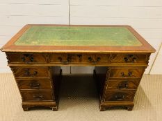 A pedestal desk with leather top