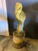 A garden statue of a stork on a small column base (H85cm)