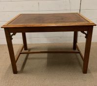 A leather top Edwardian coffee table (H48cm W68cm D49cm)