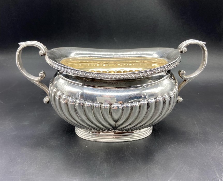 A Three piece silver tea set to include teapot, milk jug, sugar bowl (Arthur & John Zimmerman) Total - Image 8 of 8