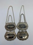 A Set of four silver plated decanter labels, Brandy, Whisky, Gin and Sherry.