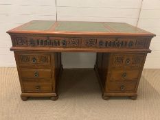 A pedestal desk with carved details to front (H81cm W140cm D78cm)