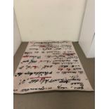 A thick pile rug, with a writing pattern (202cm x 253cm)