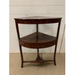 A mahogany corner wash stand