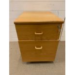 A light oak filing cabinet