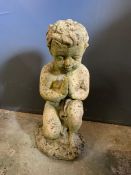 A garden statue of a little boy kneeling (H37cm)