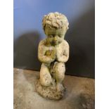 A garden statue of a little boy kneeling (H37cm)