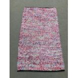 An Indian woven rug in pink (5ft x 3ft)