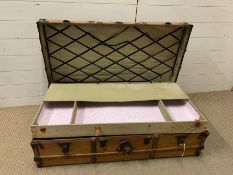 A wooden and metal bound trunk with tray insert (W110cm D55cm)