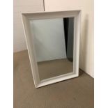 A painted white wall mirror with a bevel edge (108cm x 76cm)