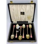 A boxed set of pink enamel and silver spoons, hallmarked for Birmingham 1949