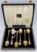 A boxed set of pink enamel and silver spoons, hallmarked for Birmingham 1949