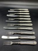 A selection of six silver handled forks and five knives