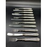 A selection of six silver handled forks and five knives