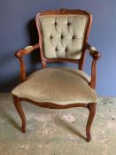 A button back open arm chair