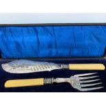 A Boxed set of fish servers with Sheffield hallmarked silver collars, makers mark CB