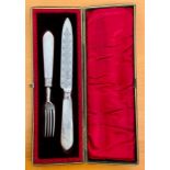 A Mother of Pearl handled knife and fork, dated Sheffield, RMEH