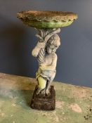 A reclaimed cherub bird bath, holding up the water basin (H92cm)