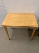 A pine fold out kitchen table