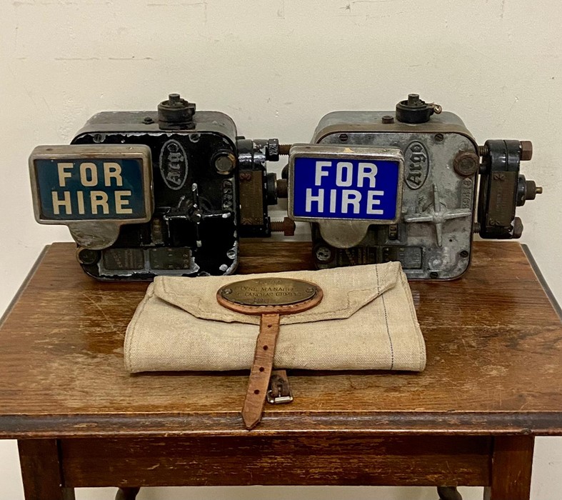 Two vintage Argo taxi cab meters along with a British Rail bag