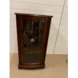 A mahogany style music/steoro cabinet with glaze doors (H106cm W55cm D46cm)