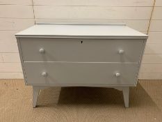 A Mid Century low two drawer chest of drawers (H68cm W93cm D46cm)