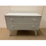 A Mid Century low two drawer chest of drawers (H68cm W93cm D46cm)