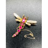 An interesting Dragonfly brooch in gold metal with stone body and safety chain 4.5cm L