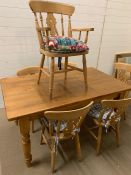 A pine farm house table and chairs