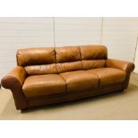 A three seater tan Italian leather sofa by Sofaitalia