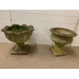 Two stone garden planter on plinths